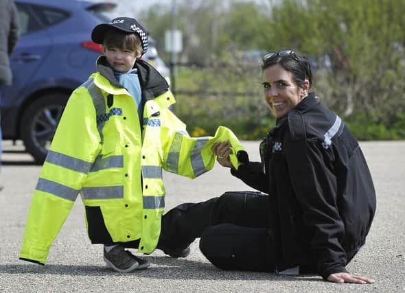 Hartlepool PCSO Julie Dobson with little Jack McCready as he dresses up during the community event at Summerhill. Picture by FRANK REID