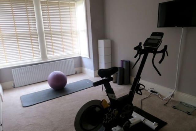 One of the rooms in the Victorian home is currently used as a gym.