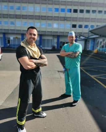 Liam with NHS worker Andrew Fox at North Tees hospital in Stockton where he started the run.