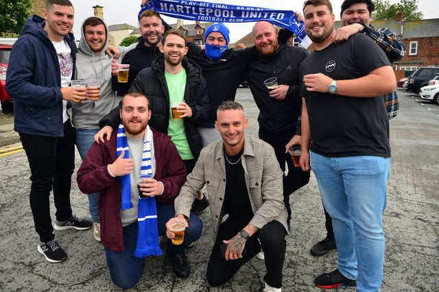 Hartlepool United fans wait for the promotion parade to pass in 2021.