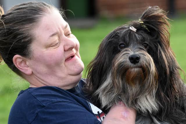 Linda McFarlane and her dog Sox, who has been awarded a commendation by the PDSA.