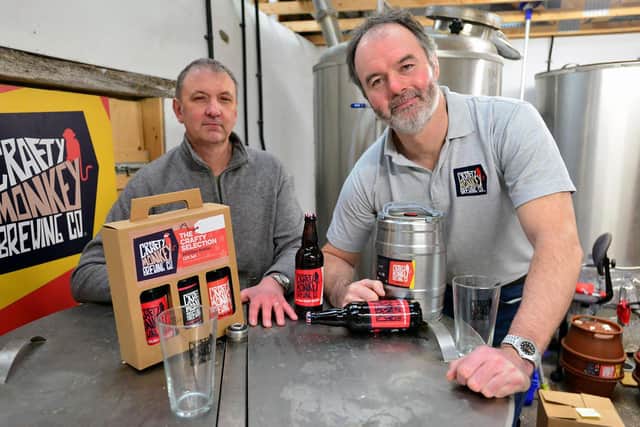 Hartlepool brewery owners Gary Olvanhill, left, and Pat Garrett, right, with some of their bottled beer.