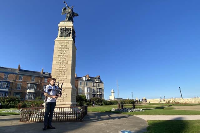 Pipe Major Christopher Pearson plays in memory of Her Majesty Queen Elizabeth II in the Redheugh Gardens War Memorial at the Headland.