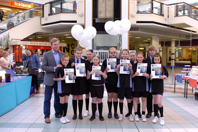 Head teacher, Andrew Jordon, joins pupils at Middleton Grange Shopping Centre in 2011 as they showcase plans for their new school building to the public.