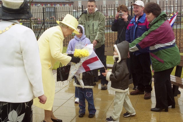 Presenting flowers to Queen Elizabeth II on her visit to the Easington Pit Disaster memorial garden in 2002.
