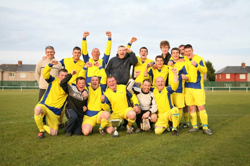 The Goldmine celebrate winning a football cup final in 2003.