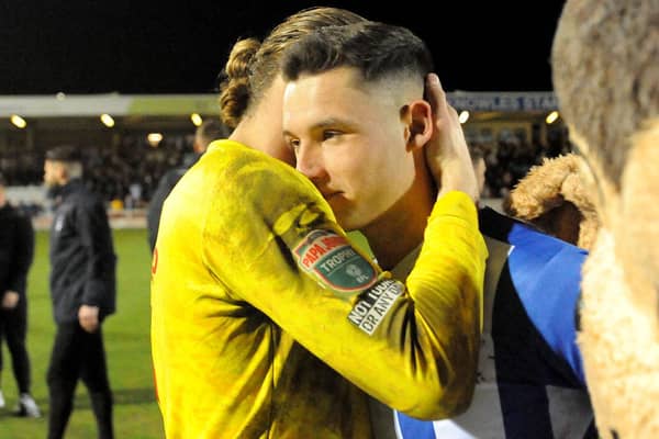 Ben Killip consoles Luke Molyneux after Hartlepool United's penalty shootout defeat to Rotherham United. Picture by FRANK REID