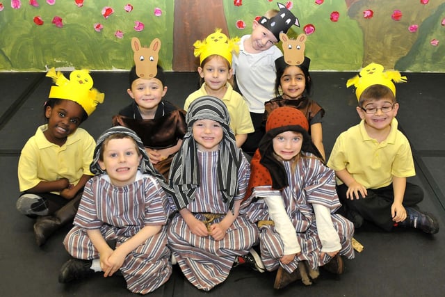 Pupils dress up as shepherds and farm animals for the school's 2012 Nativity play.