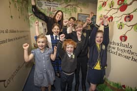 St Peter's headteacher Vikki Wilson celebrates with children after the school's "good" Ofsted report.