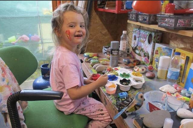 Five-year-old Raegan (Roo) Brunskill, painting rocks in her painting shed in Middlesbrough in her grandparents' garden.