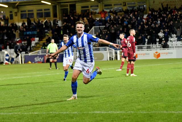 Mark Shelton celebrated scoring a late winner against Rochdale at the Suit Direct Stadium in December during Graeme Lee's first home game in charge. Picture by FRANK REID