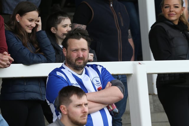 These Hartlepool United supporters watch on during the final game of the season with Colchester United. (Credit: Mark Fletcher | MI News)
