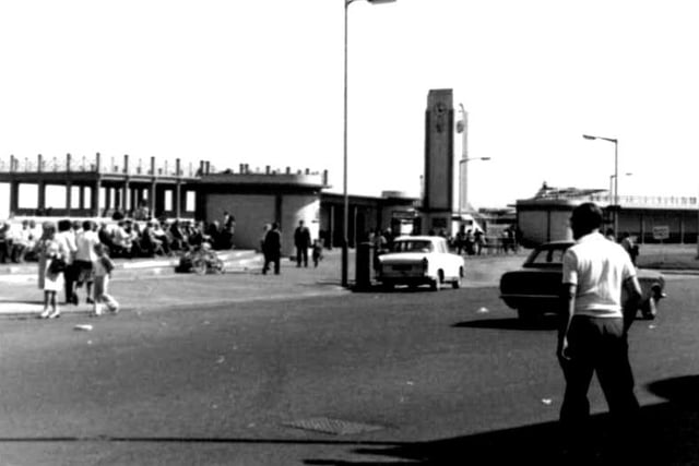 A 1970s look at crowds seated at the bus station at Seaton Carew with the roller coaster in the fairground in the background. Photo: Hartlepool Library Service.