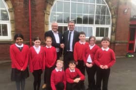 Andy Brown, right, and Paul Newton with pupils from Deaf Hill Primary School.