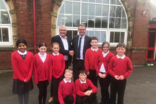 Andy Brown, right, and Paul Newton with pupils from Deaf Hill Primary School.