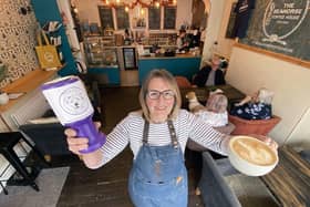 Helen Gregory of Seahorse Coffee House with a cuppa and collection tin for Maxi's Mates. Picture by FRANK REID