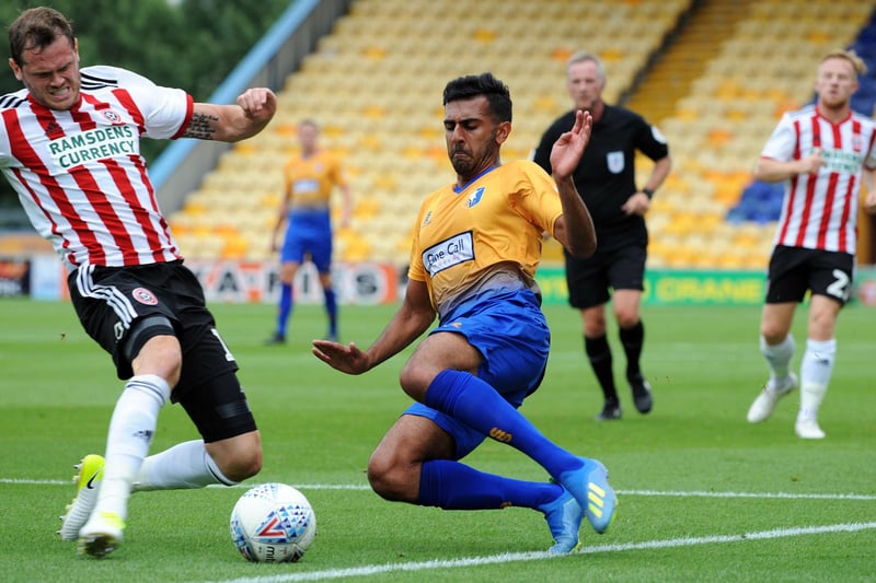 Benning goes in for the tackle in a pre-season friendly with Sheffield United.