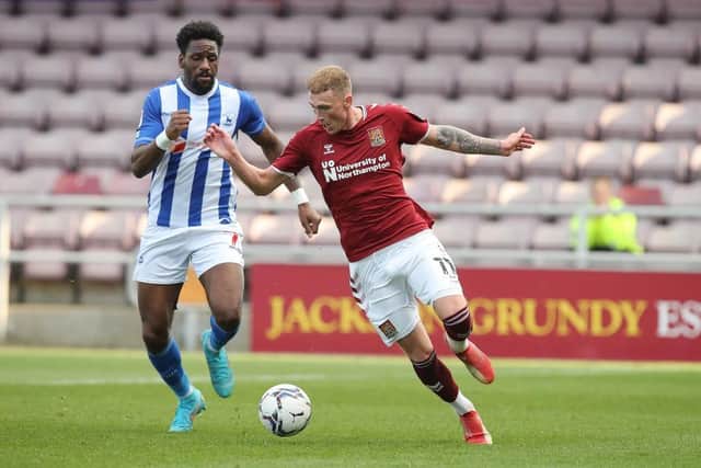 Mitch Pinnock of Northampton Town attempts to move away from Omar Bogle of Hartlepool United. (Photo by Pete Norton/Getty Images).