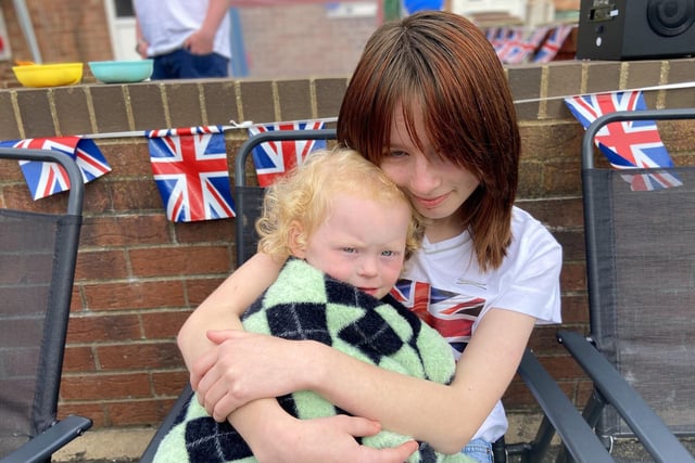 Katie Ramsay getting a cuddle from her big sister Cara during the Jubilee Party at Lanark Road, Hartlepool. Picture by FRANK REID