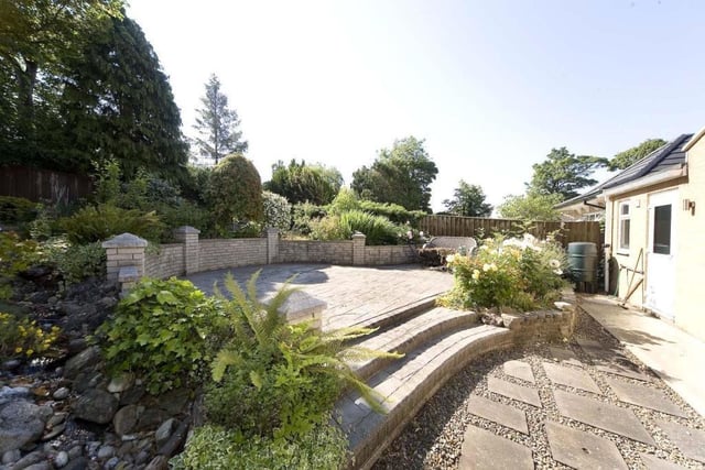 The patio and seating areas in the garden are ideal for entertaining guests in the summer.