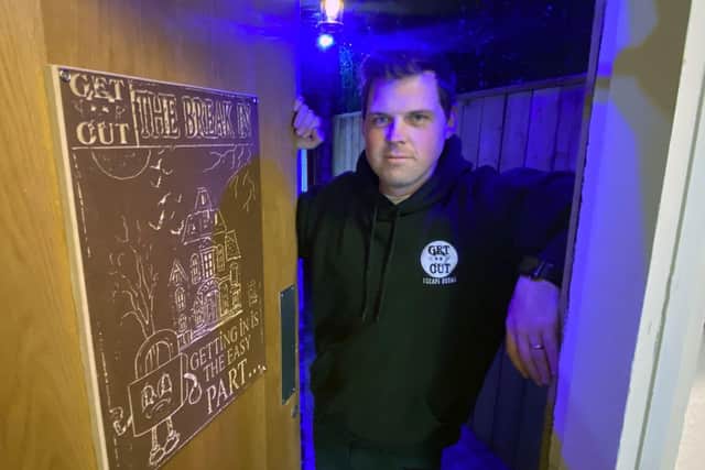 Alex Matthews inside Get Out Escape Rooms' new room, The Break In.