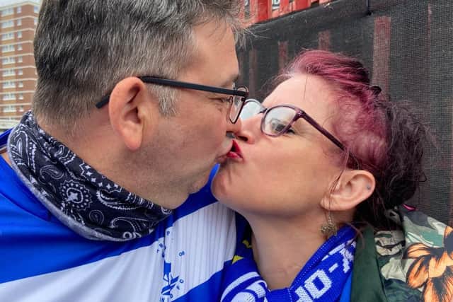 Sealed with a kiss: Russ and Lisa on their way to Hartlepool United's historic promotion win.