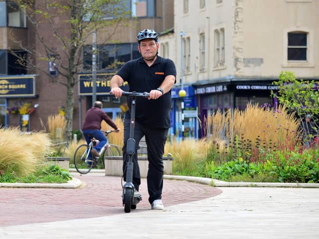 Hartlepower e-scooter scheme ambassador Marty Fishwick with one of the scooters in Church Square. Picture by FRANK REID