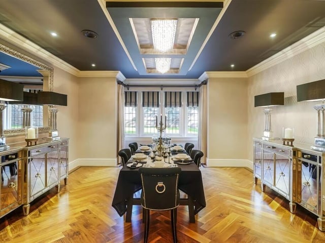 This well-lit dining room is a great place to entertain guests or family and friends.