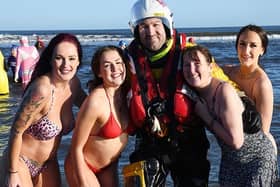 Hartlepool RNLI volunteer Ken Hay with Boxing Day dippers (left to right) Vicky, Hannah, Gail and Katie Rhodes. Picture: Tom Collins.