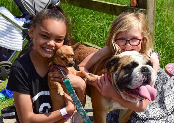 Rhianna Ibrahim (left) with chihuahua Princess and Madeline Cranney with British bulldog Winston at an event in aid of Alice House Hospice in 2018.