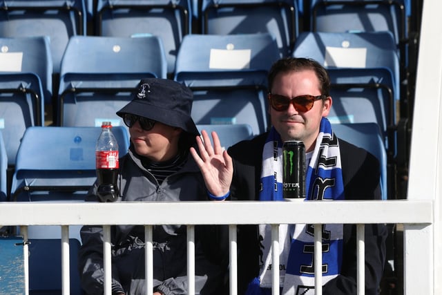 One Pools fan got the memo to give the camera a wave (Credit: Mark Fletcher | MI News)