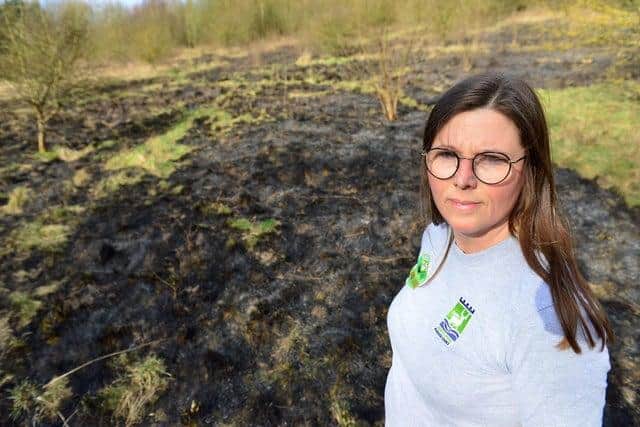 Claire McDonald, senior outreach officer at Summerhill Country Park, next to the area of land that was set on fire last week.