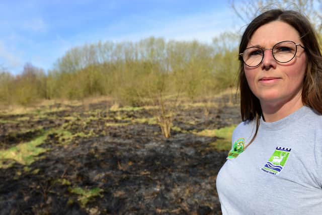 Claire McDonald Senior Outreach Officer at Summerhill Country Park next to the area of land that was set on fire. Picture by FRANK REID