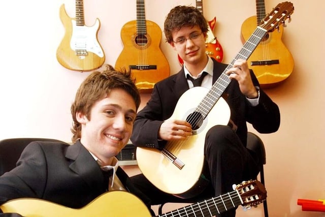 These guitar players got the spotlight at the school 19 years ago. Recognise them?