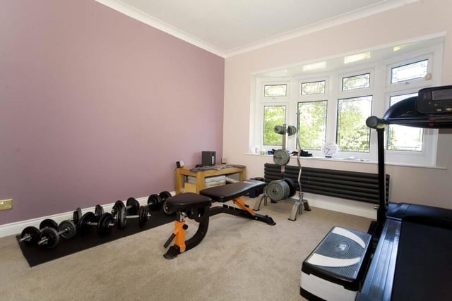 One of the bedrooms is currently being used as a gym.
