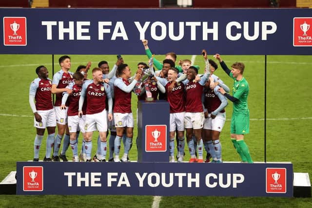 Players of Aston Villa celebrate with the trophy following the FA Youth Cup Final match between Aston Villa U18 and Liverpool U18 at Villa Park on May 24, 2021 in Birmingham, England. (Photo by Alex Pantling/Getty Images)