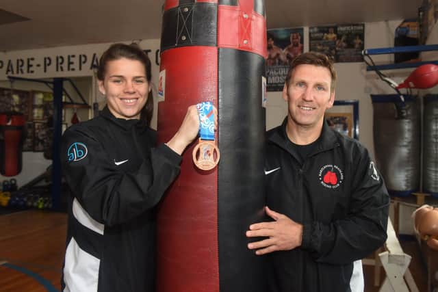 Flashback: Savannah Marshall with Headland Amateur Boxing Club coach Tim Coulter after winning a bronze medal at the World Championship.