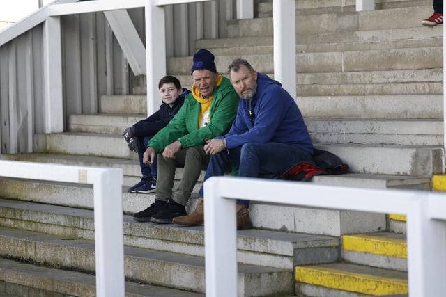 Three fans wait for play to get underway. Photo: Mark Fletcher | MI News