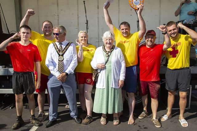 The Boys Brigade Baywatch raft team get presented with the trophy for coming first from the Mayor and Mayoress.