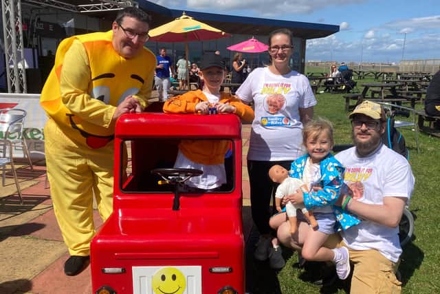 Left to right: Stephen Picton, Riley Bains, parents Sarah Kidson and Stephen Bains and their daughter Matilda at the end of the Smiley For Riley Walk.