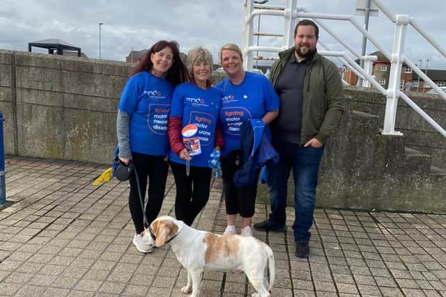 Sandra gets ready for one of her walks, with daughters Jayne Donkin,  Michelle Moran, grandson Ryan Marshall, and Archie the dog for company.