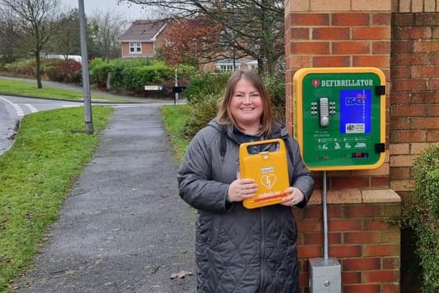 Louise Deer, guardian of the new defibrillator on Merlin Way at Bishop Cuthbert.