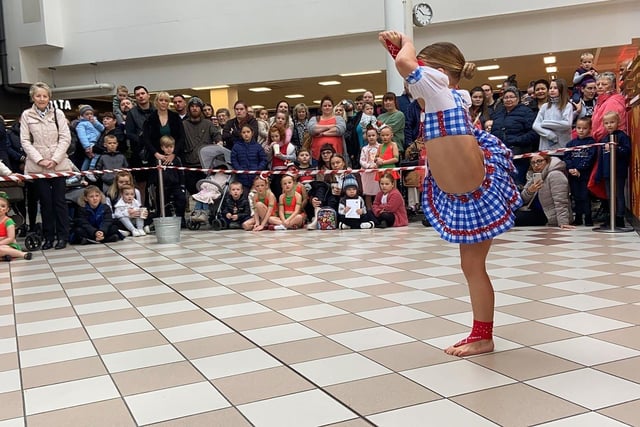 A dancer from VA Performing Arts entertaining the crowd as they wait for Santa to arrive at Middleton Grange Shopping Centre. Picture by FRANK REID
