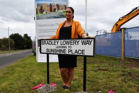 Gemma Lowery, pictured behind the Bradley Lowery Way sign, when the street was pictured in September 2021.