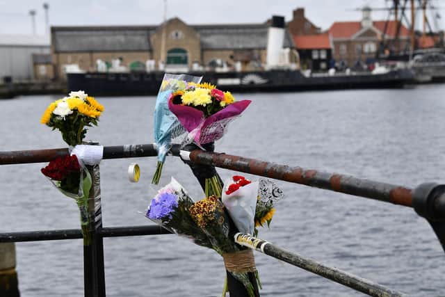 Flowers left in memory of Adam Thomas