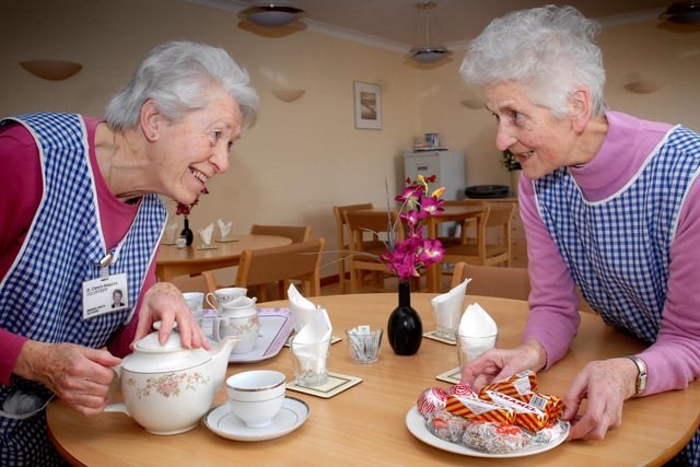 Volunteers Brenda Smith and Moyra Atkinson were loving their volunteer work at St Clare's Hospice in 2012.