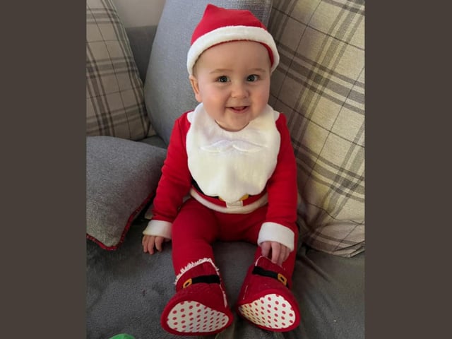 Harry, age 8 months, is ready to lend a helping hand on Christmas Eve.