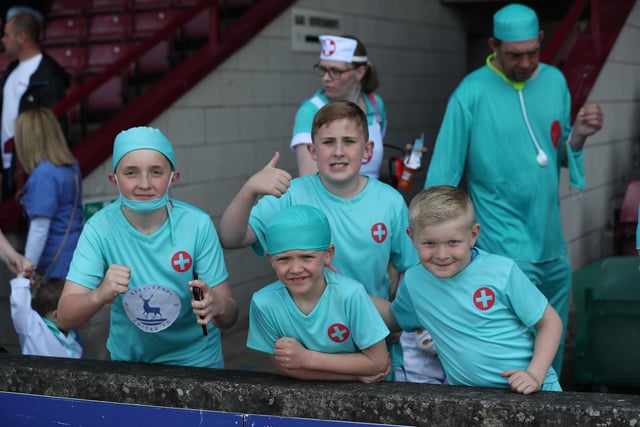 Young Pools supporters got on board with the fancy dress theme of doctors and nurses at Scunthorpe United. (Credit: Mark Fletcher | MI News)