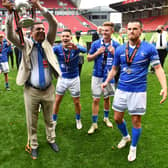 Hartlepool United chairman Raj Singh celebrates promotion with the players following their penalty shoot-out victory over Torquay United on Sunday.