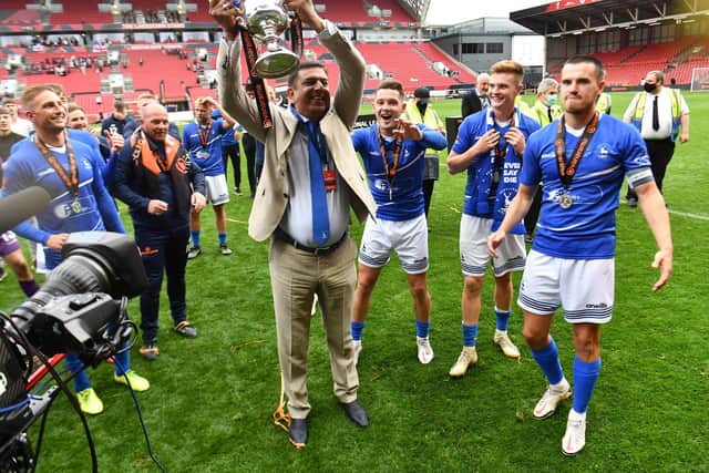 Hartlepool United chairman Raj Singh celebrates promotion with the players following their penalty shoot-out victory over Torquay United on Sunday.
